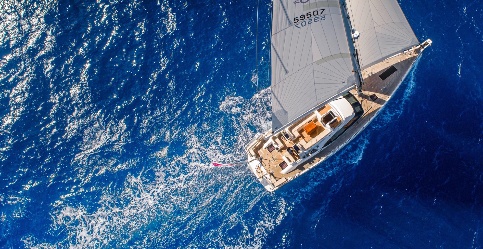 60 foot sailing yacht sailing at sea drone shot