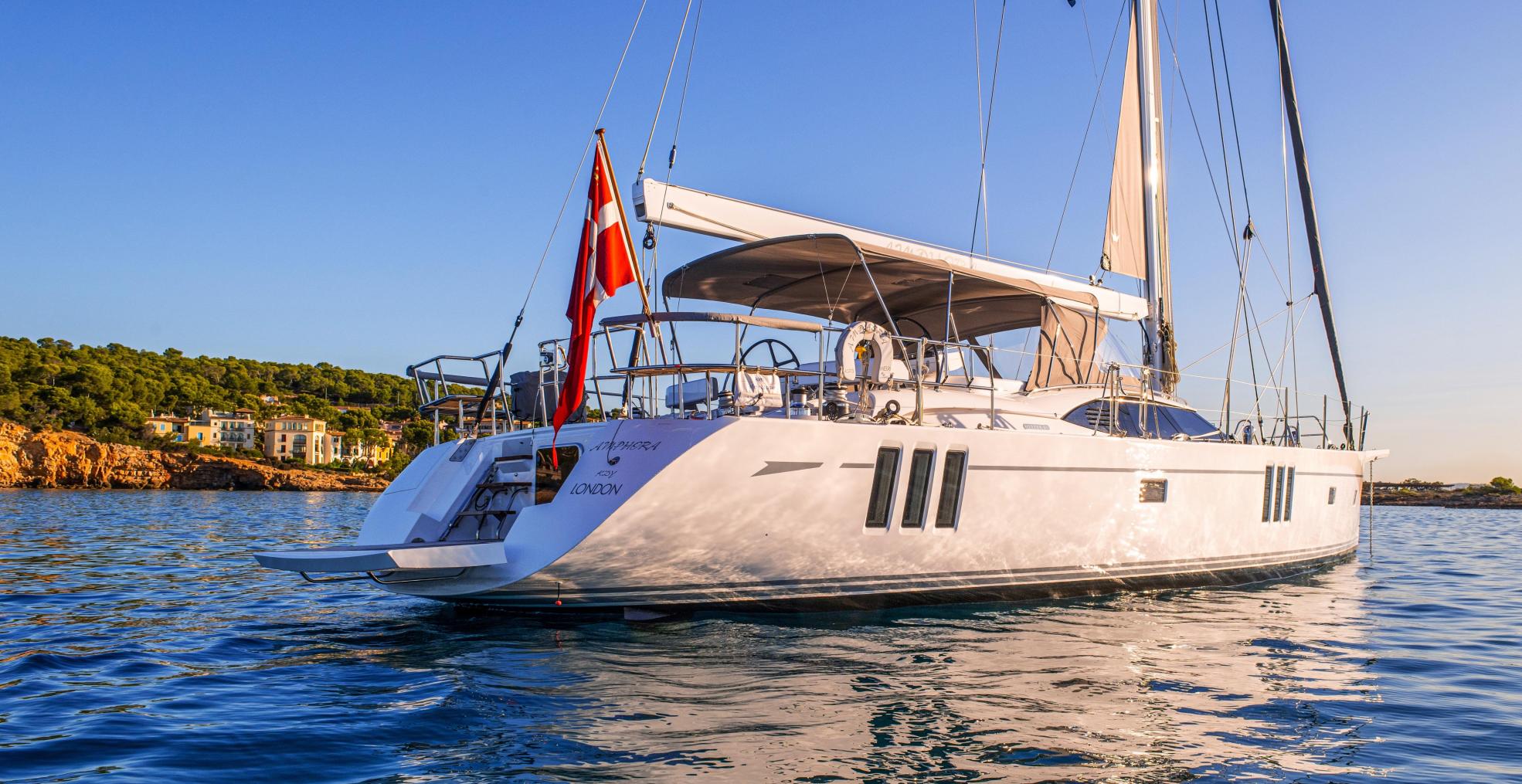 70 foot oyster sailing yacht at anchor sunset