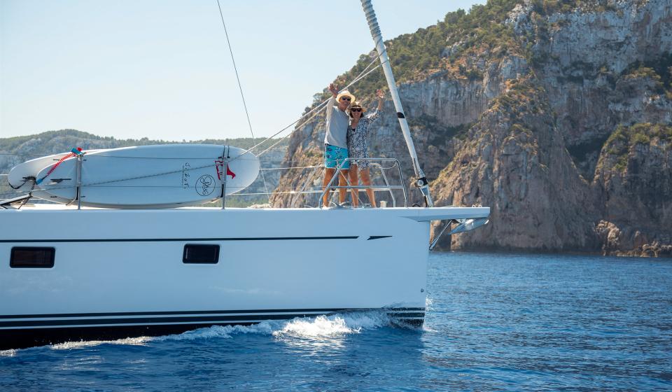 Couple on foredeck of Oyster 595 JaZoFi Ibiza