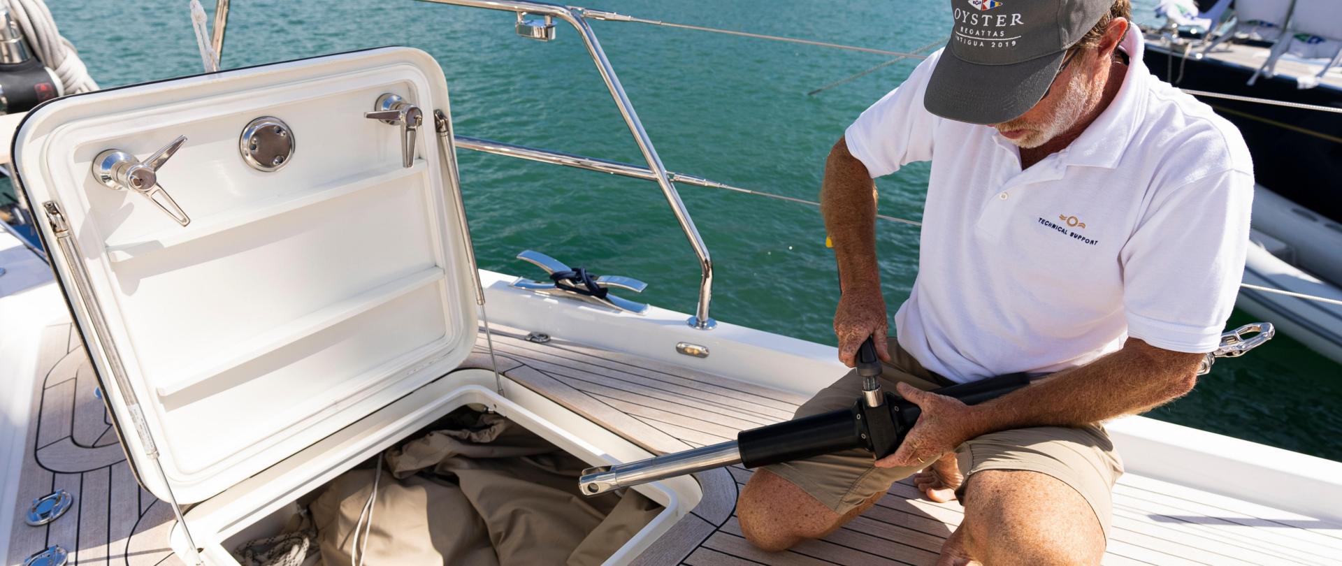 Oyster World Rally Teams Hero Image Man Fixing Yacht On Deck 2