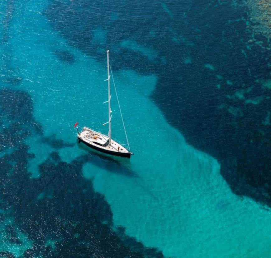 Oyster charter yacht in crystal blue sea v2