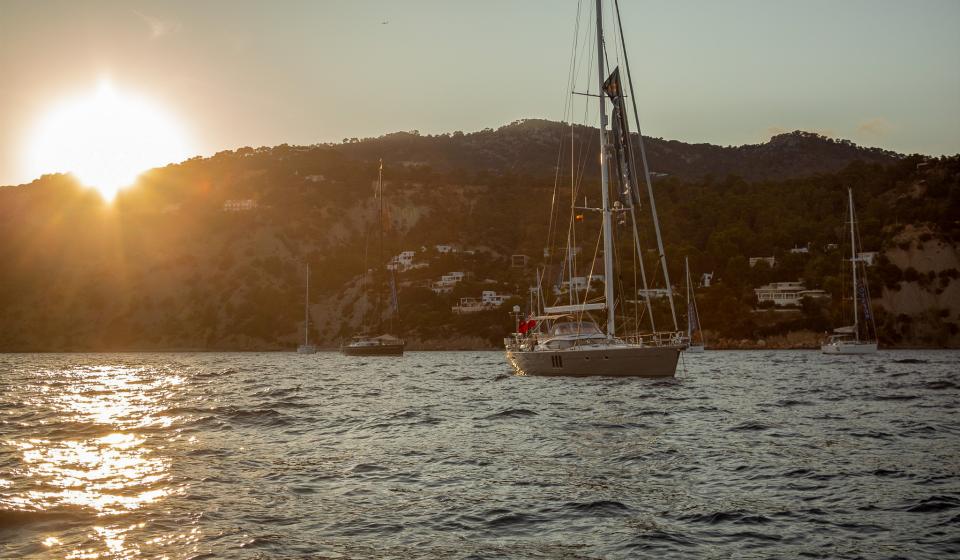 Sunset in Ibiza Oyster yachts at anchor