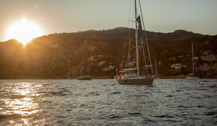 Sunset in Ibiza Oyster yachts at anchor