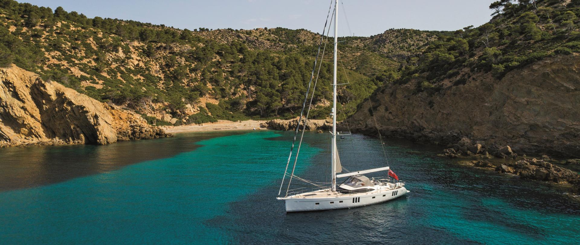 sailing yacht in small cove