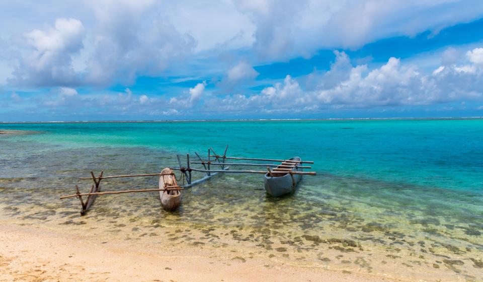 65. Traditional polynesian style double hulled canoes on a Fiji beach