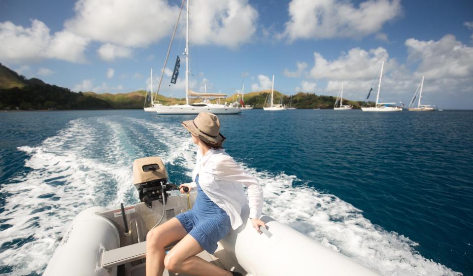 66. Lady driving a boat on the ocean