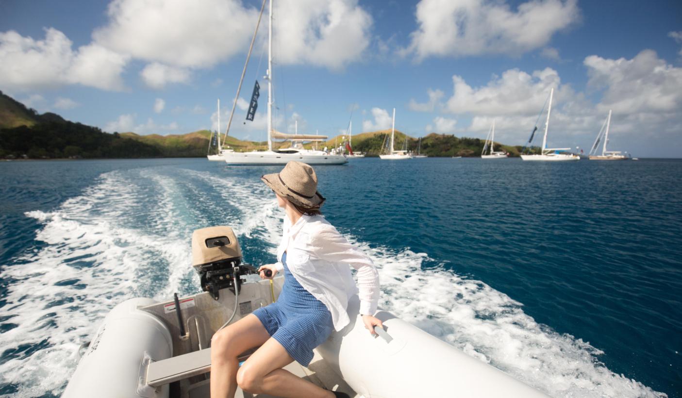 66. Lady driving a boat on the ocean