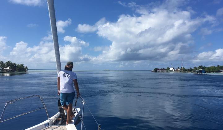 70. Man looking out to sea while sailing