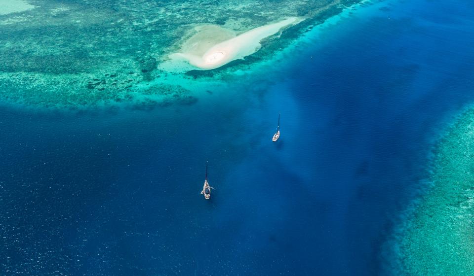 Aerial view two Oyster yachts sailing Indonesia