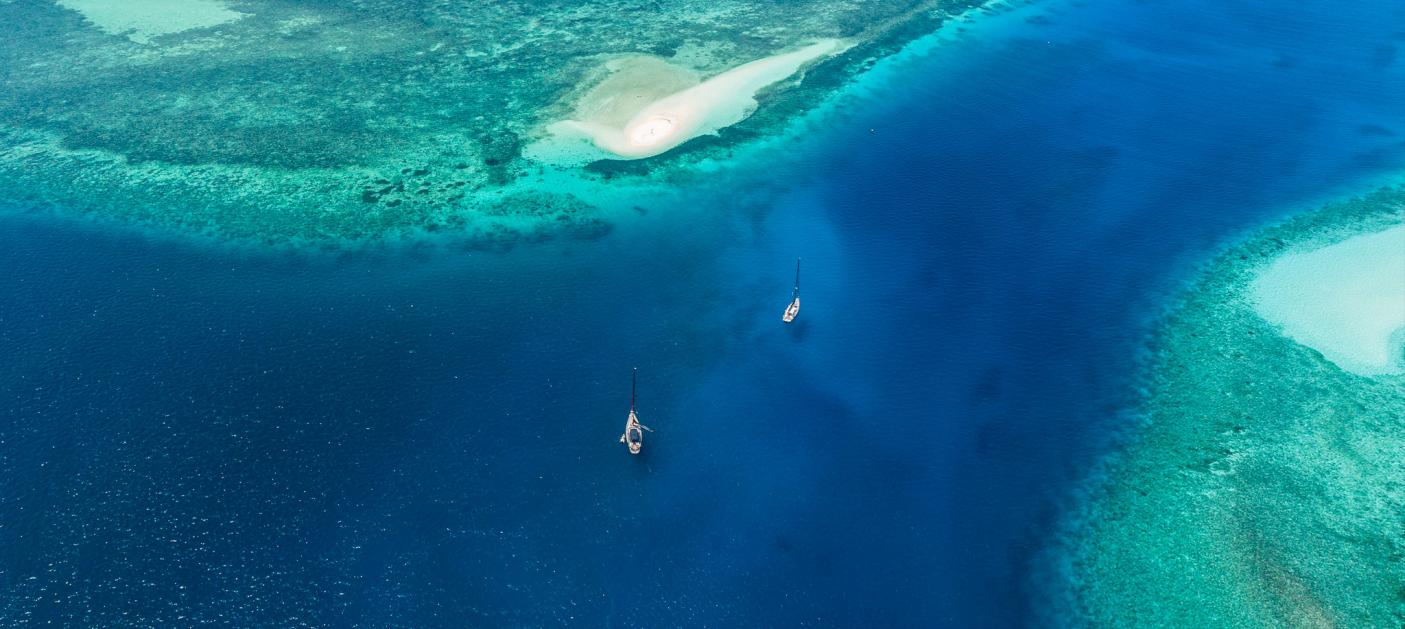 Aerial view two Oyster yachts sailing Indonesia