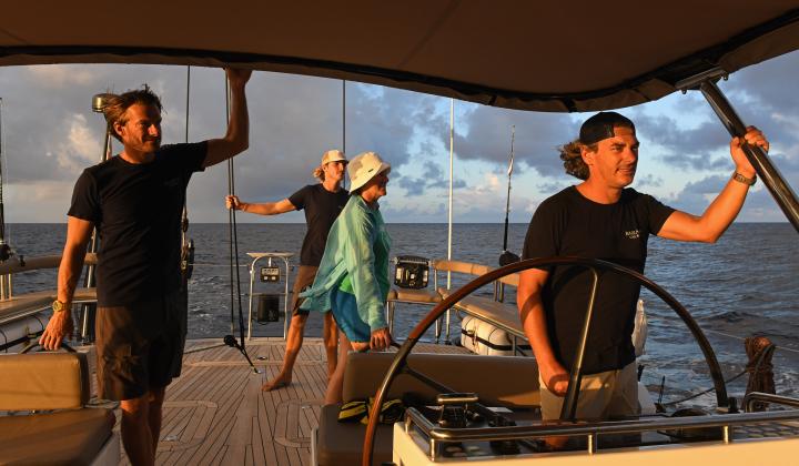 Crew on board Oyster 885 Babiana Sailing Towards Marquesas Islands Sunset