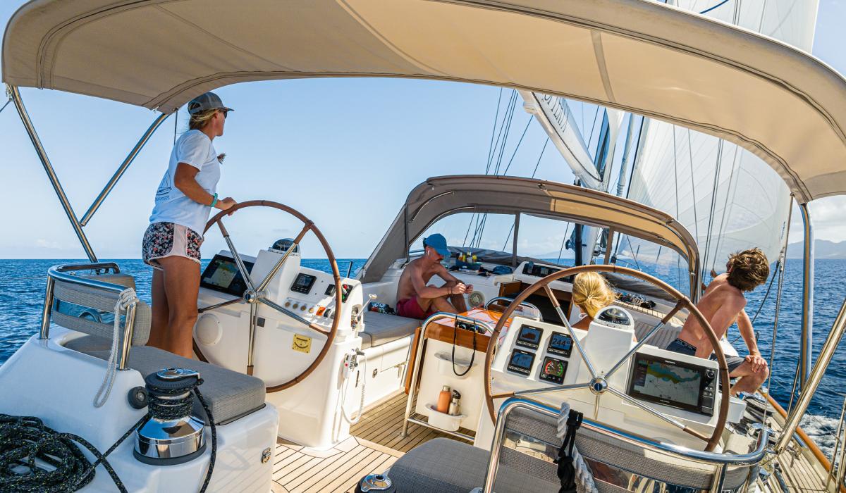 Crew on board Oyster sailing yacht helm stations
