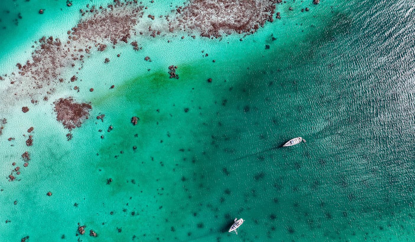 Drone shot of Oyster yachts in Kauehi Tuamotus French Polynesia