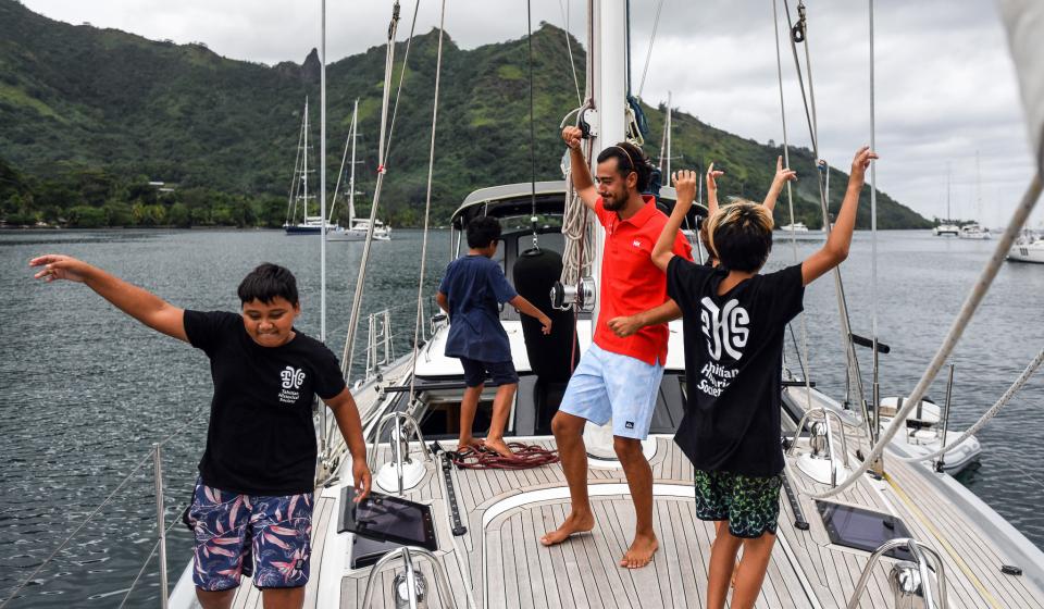 Local children dancing on board Oyster 575 Ahlam