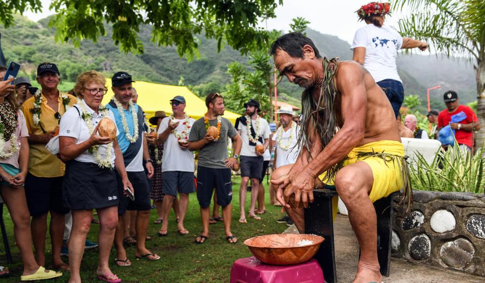 Opening fresh coconuts Nuku Hiva