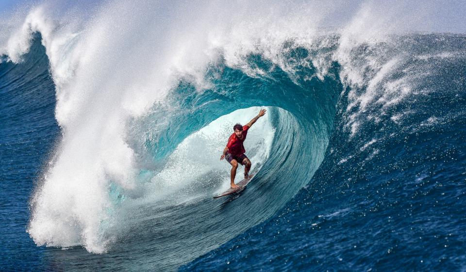 Professional surfer in Tahiti Teahupoo