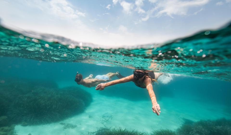 Snorkelling in crystal clear waters Sardinia Italy