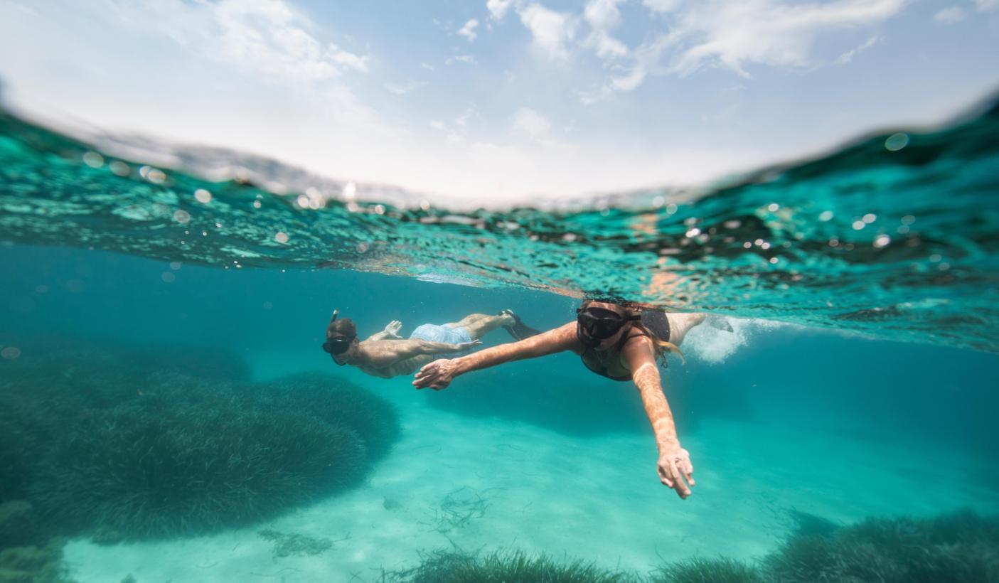 Snorkelling in crystal clear waters Sardinia Italy