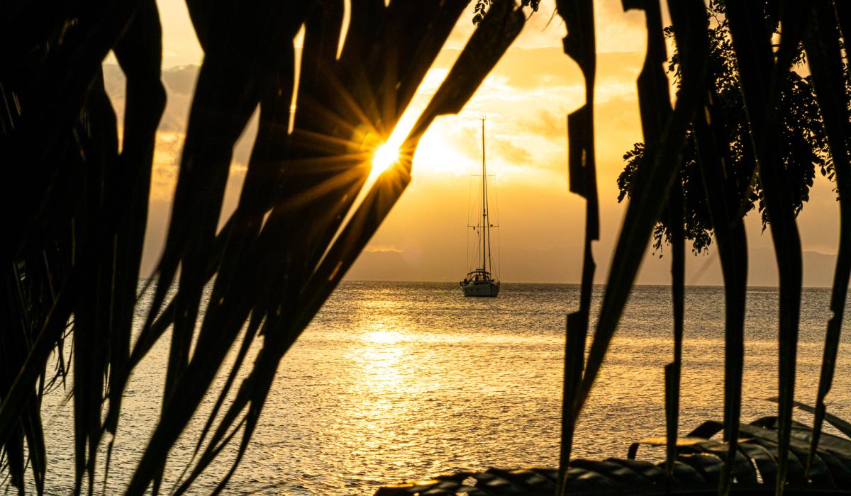 Sunset over sailing yacht in Fiji