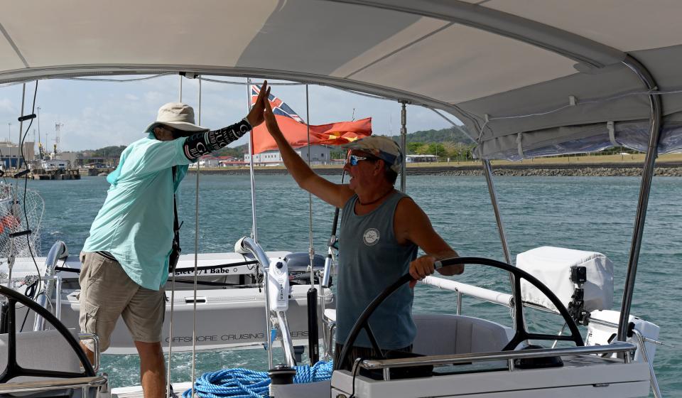 Transiting Panama Canal on Babe The Advisor and Paul celebrate getting to the Pacific