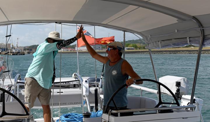 Transiting Panama Canal on Babe The Advisor and Paul celebrate getting to the Pacific