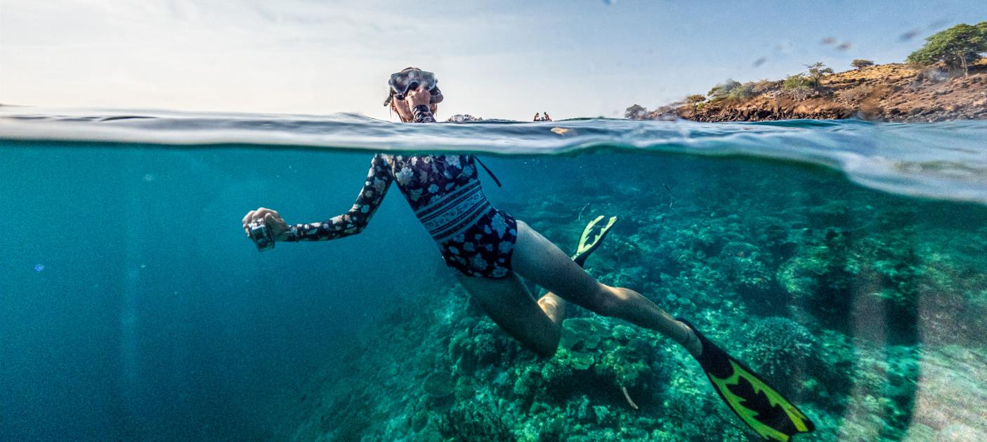 Woman snorkelling underwater shot Fiji