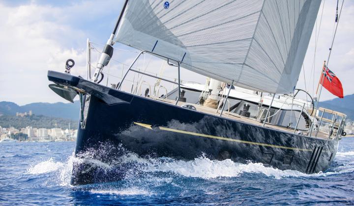 blue hull 70 foot sailing yacht at sea