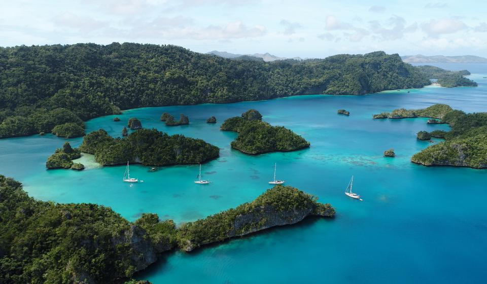 oyster yachts at anchor in blue sea