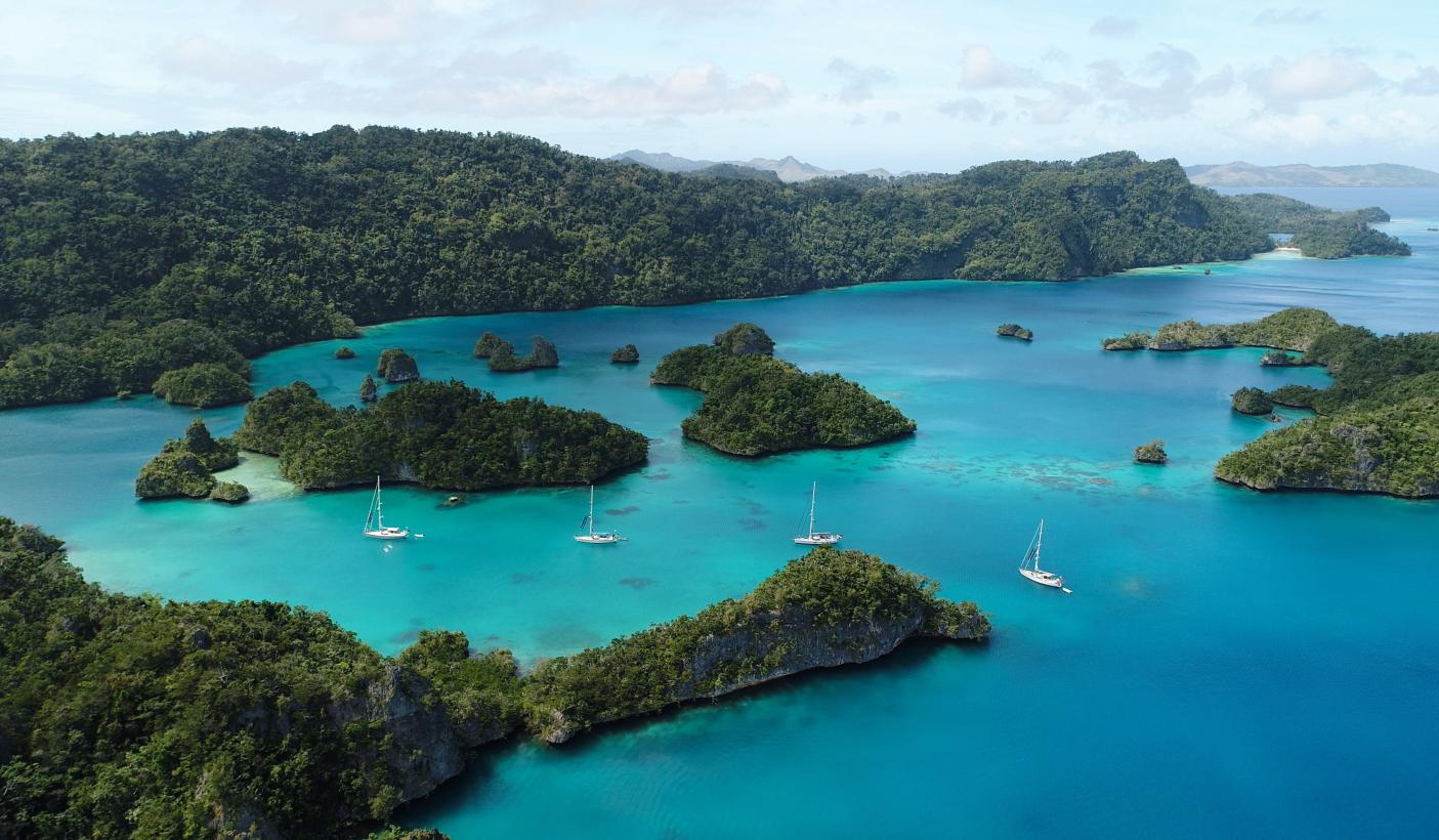 oyster yachts at anchor in blue sea