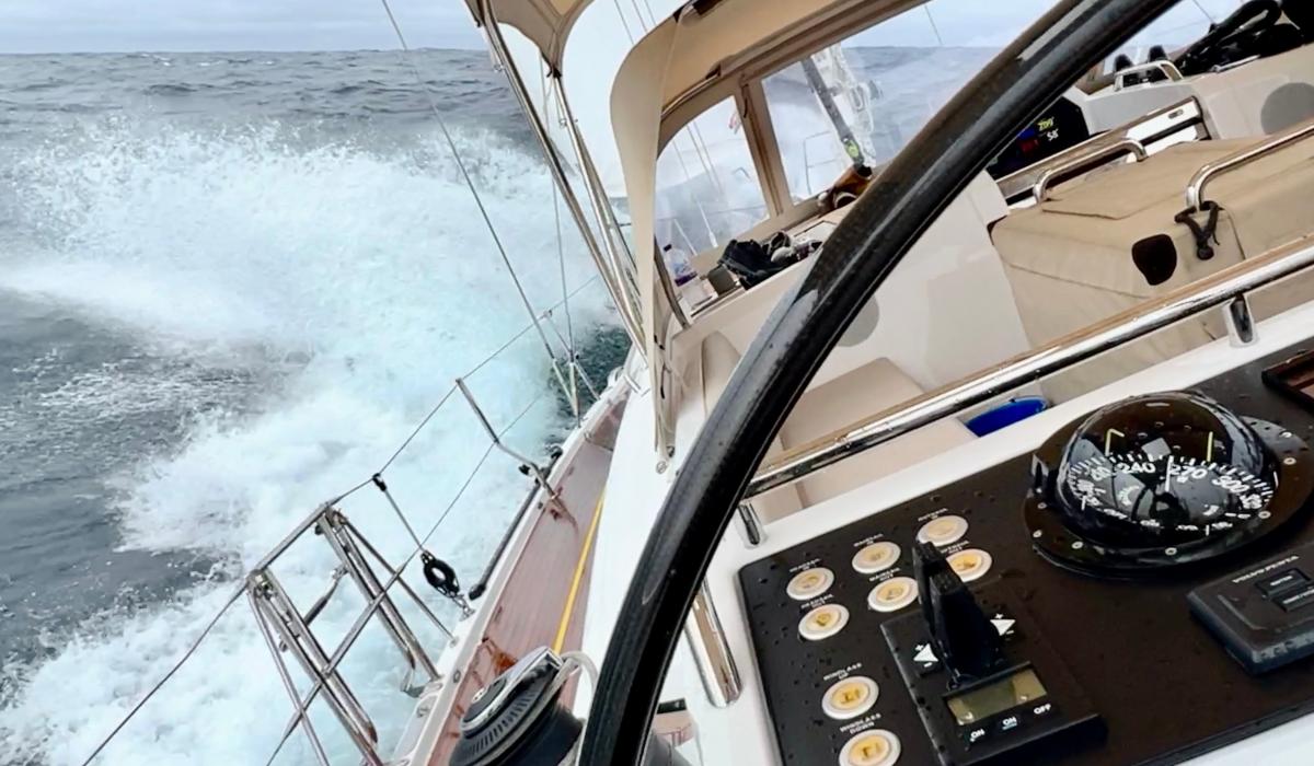 yacht crashing through waves