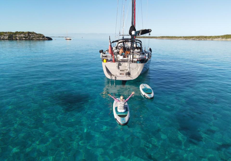 Sailing yacht and paddle board