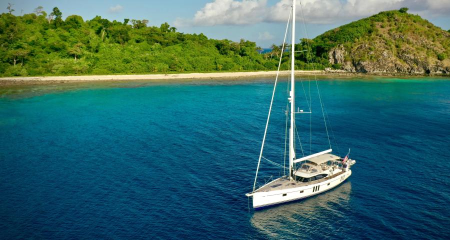 Oyster Yachts Oyster 565 Rally Yacht Anchored by beach 1