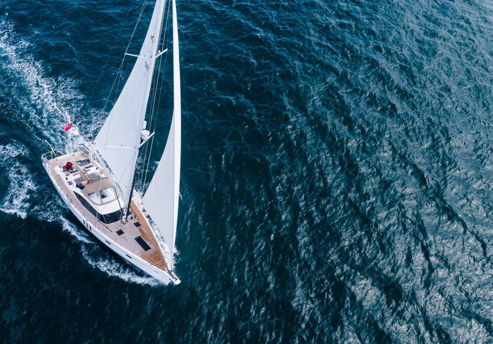 Oyster yacht sailing from above