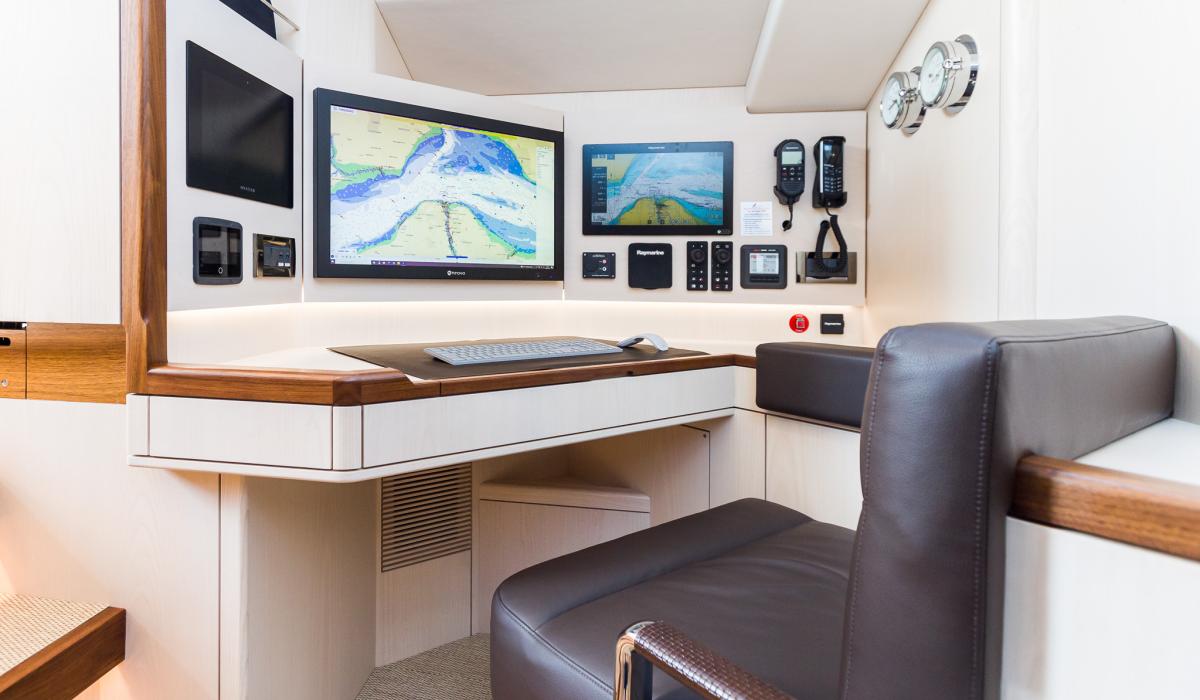 Oyster 855 90 Foot Sailing Yacht Interior Navigation Station Ash Wood Finish